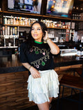 Lucky Charm - Black with Green Border Hem Graphic Tee